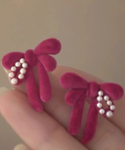 Raspberry Powder Sterling Silver Flocking Pearl Bow Stud Earrings