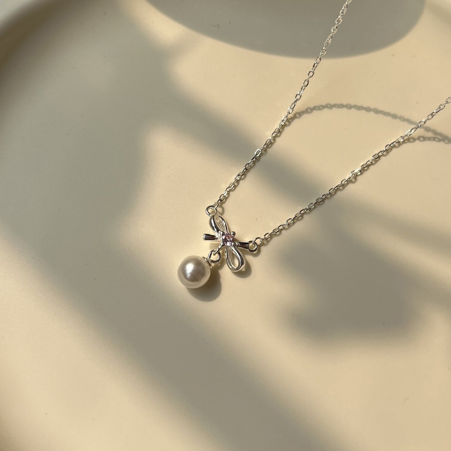 Cady Bow and Pearl Necklace